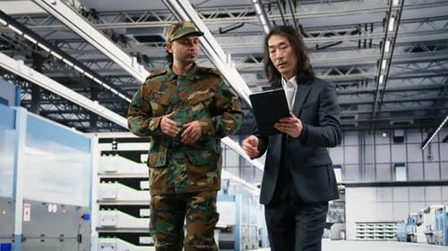 Soldier Collaborating with Microchip Production Factory Manager