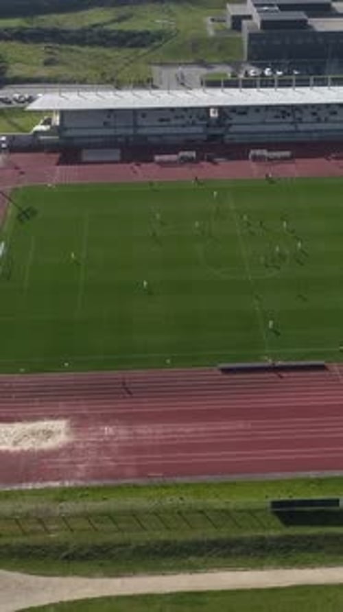 Aerial View of Soccer Game on Bright Day