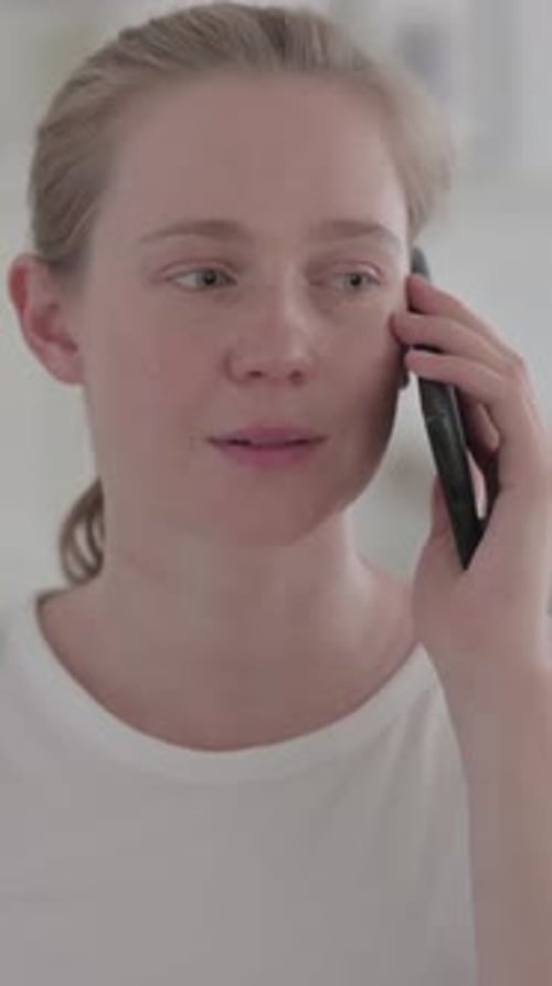 Woman Talking on Mobile Phone in Portrait Video