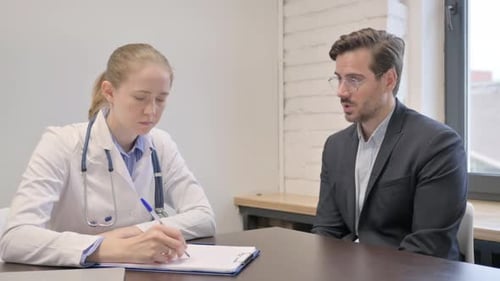 Doctor Consults with Patient in Bright Office