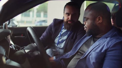 Client Learning About Automobile Safety Features During Car Test Drive