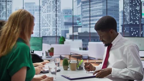 Job Interview Candidate Signing His Employment Contract at the Office