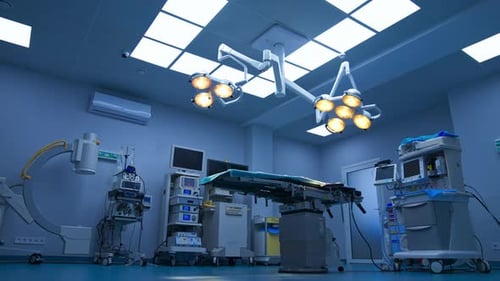 Well-equipped surgical theatre with bright illumination.