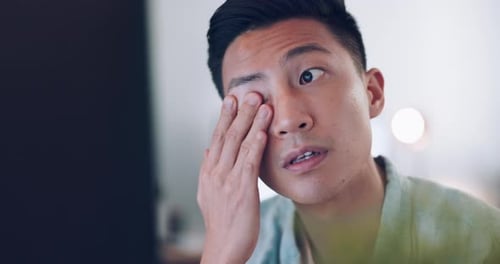 Asian businessman, tired and hand on face in communication office, headache and marketing company