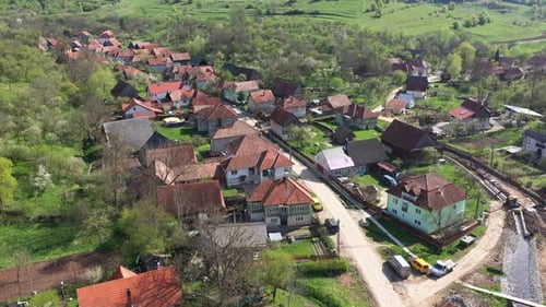 Aerial View of a Small Countryside Village. Flying Over Village Street and House Roofs. Inucu, Inakt