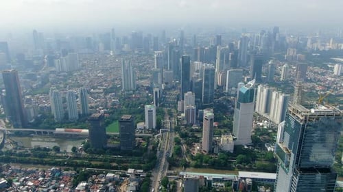 Unique overview of Jakarta skyscrapers, Indonesia. Aerial forward
