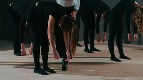 Young People Stretching in Dance Class