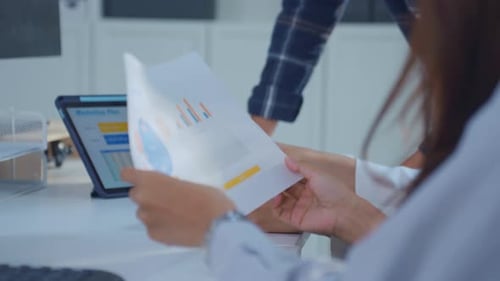 Close up of young businessman and businesswoman people work in office.