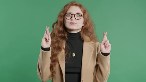 Stylish BusinessWoman Praying Crossed Fingersgreen backgroundLady Begs Someone