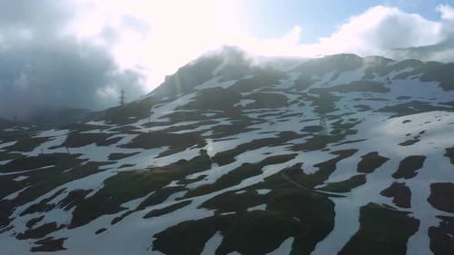 Aerial view of rests of snow in the Alps during the summer near the Little St Bernard Pass.