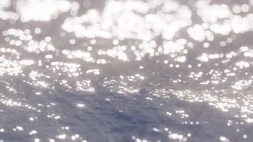 Pequenas ondas e reflexos do sol na superfície da água de perto.