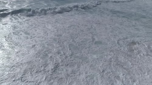 Aerial view beautiful beach with views of ocean waves and water crashing on to sandy beach