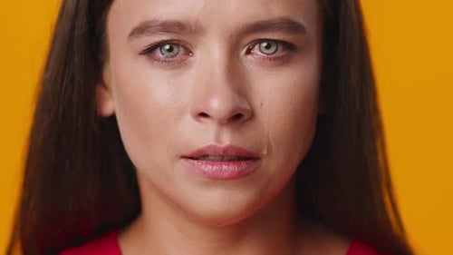 Young Adult Woman Crying Tears in Studio Close Up