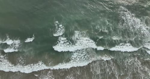 Pacific Ocean Sea Splashing Wave Texture of Sea Foam Flying By Drone Top Aerial View