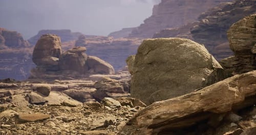 Majestic Rock Formations in a Rugged Desert Landscape During Sunset