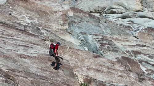 Caucasian Hiker on the Glacial Valley Trail. Scenic Norwegian Hiking.