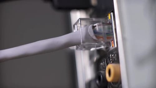 Connecting Ethernet Cable to Computer Port Close Up