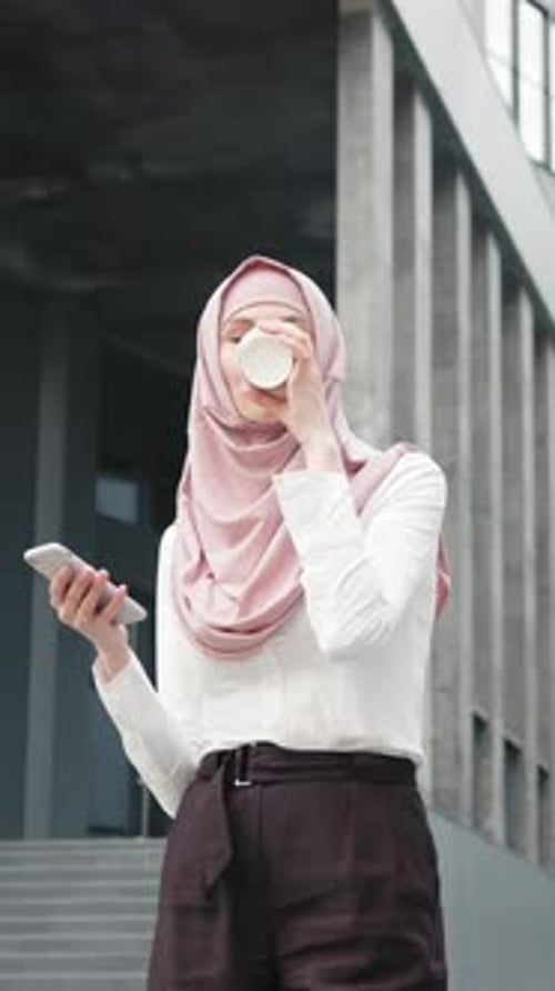 Vertical Screen Attractive Arabian Woman Standing Near Office Center and Holding