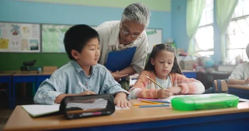 Education, teacher and kids in classroom for help, explain and learning in elementary school