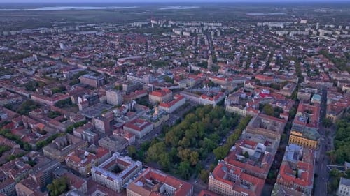 Aerial view of sunset over cityscape with rooftops, Hungary.