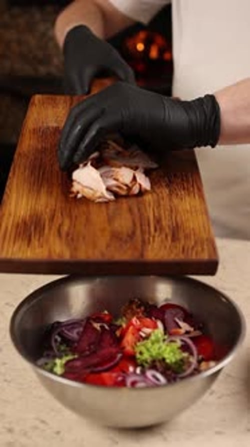 Chef prepares a delicious salad in a restaurant