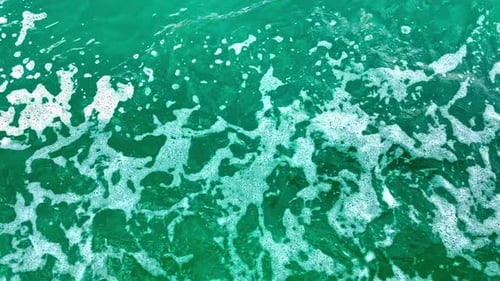 Ocean sea water foam spume, waves wind moving texture, turquoise color