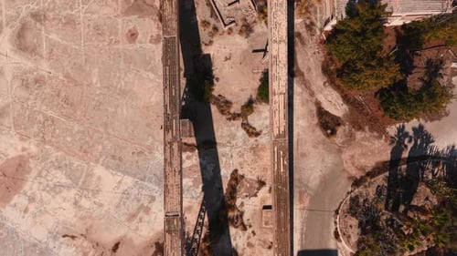 Aerial View Flying Over Abandoned Industrial Factory Ruins at Sunset