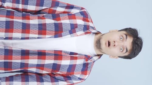 Surprised Man Wearing Plaid Shirt Close Up
