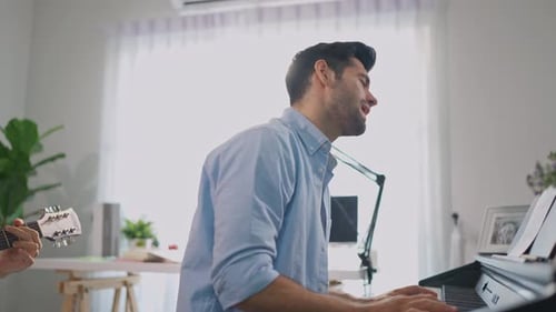Musician Singing and Playing Piano, with Guitar Accompaniment