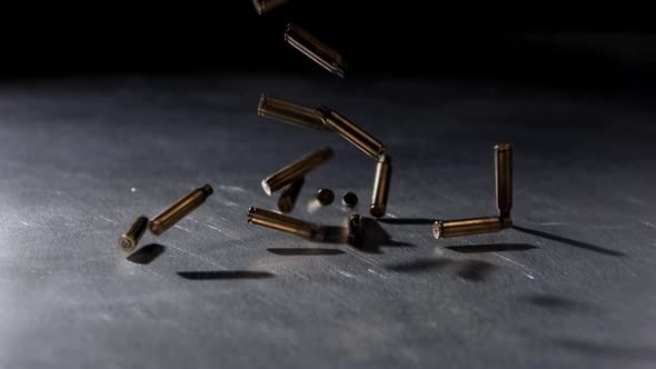 Bullet Shells Falling on Metallic Surface, Military Stock Footage ft ...