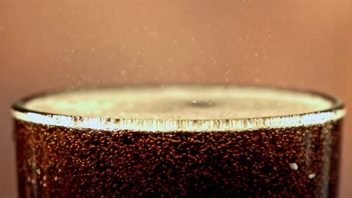 Cola Drink in a Glass with Bubbles in the Air