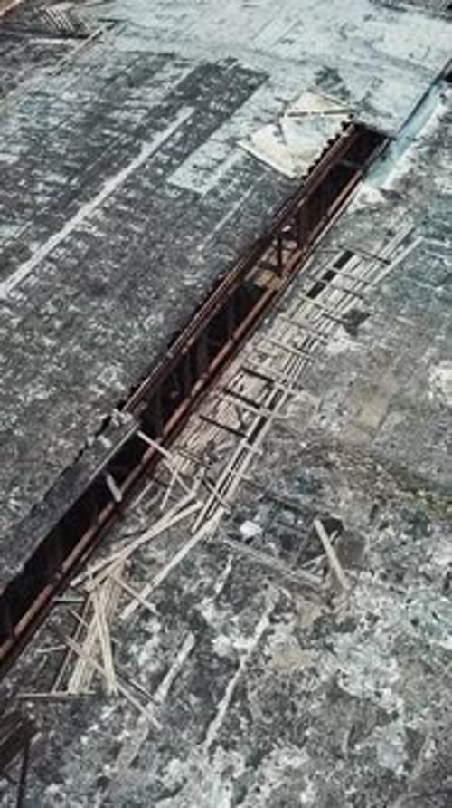 Ruins of an old factory. Old industrial building for demolition. Aerial view. Vertical video