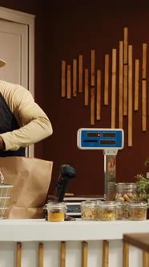 Vertical Video Vendor Weighting Goods for Customer at Cash Register in Store