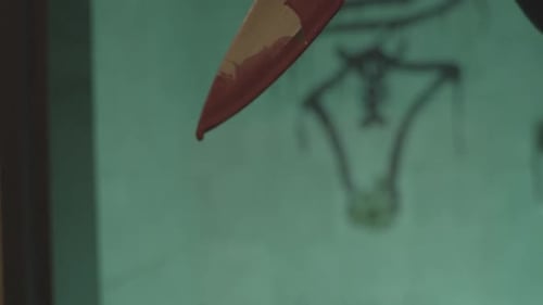 Close Up Of Red Blood Dripping From Knife Blade. Horror Story Concept.