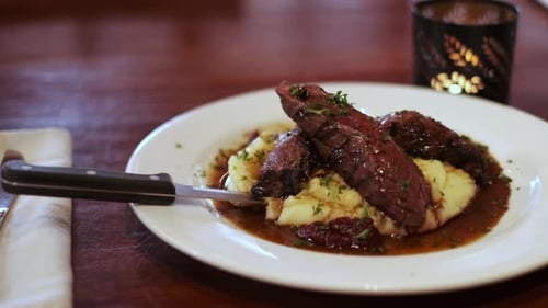 Steak and Mashed Potatoes on White Plate