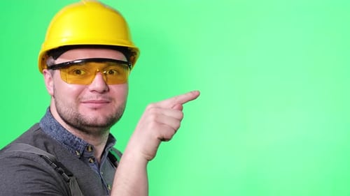 Construction Worker in Hard Hat Pointing Right