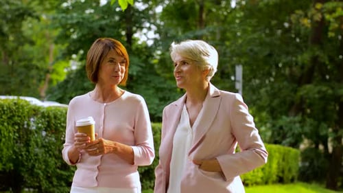 Women Walking and Talking in a Park