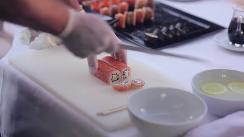 Sushi Master Slicing Philadelphia Rolls