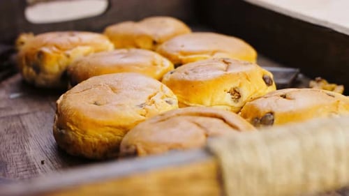Many Briochettes Arranged on a Wooden Background