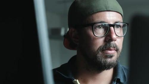 Man Wearing Glasses Looking at Computer Screen Close Up