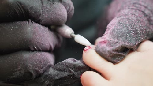 Toenail Filing by Technician with Electric File