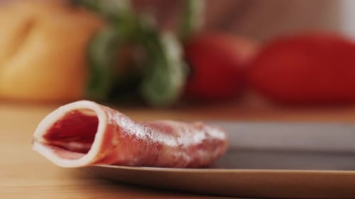 Black Bull Sausage Ham Tongue Pork Drycured Sausage on a Black Background Traditional Spanish