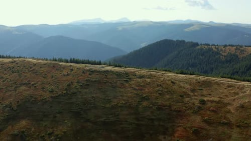 Aerial Beautiful Hills Road Way for Travellers Stunning Rocky Mountains Panorama. Sunny