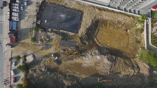 Aerial Video Aerial View of a Busy Construction Site with Heavy Equipment and Active Work