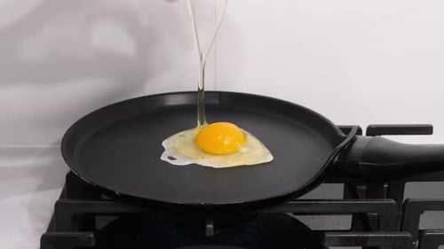 Cracking Egg in Pan