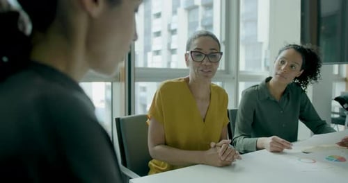 Three Businesswomen, Meeting and Working in Office