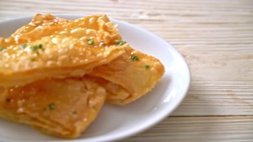 Crispy Pastries on a White Plate with Glaze