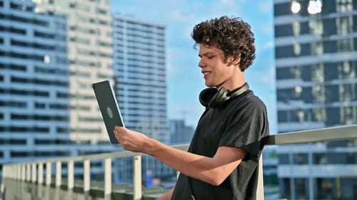 Young Handsome Man Having Video Call Chat on Digital Tablet Outdoor City Background