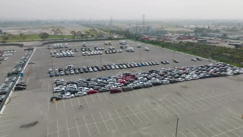 Aerial top view from drone of parking lot cars.