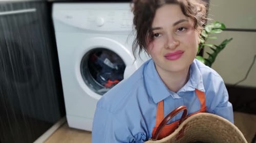 Woman Doing Laundry at Home Close Up